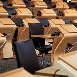 Empty chairs in the Debating Chamber