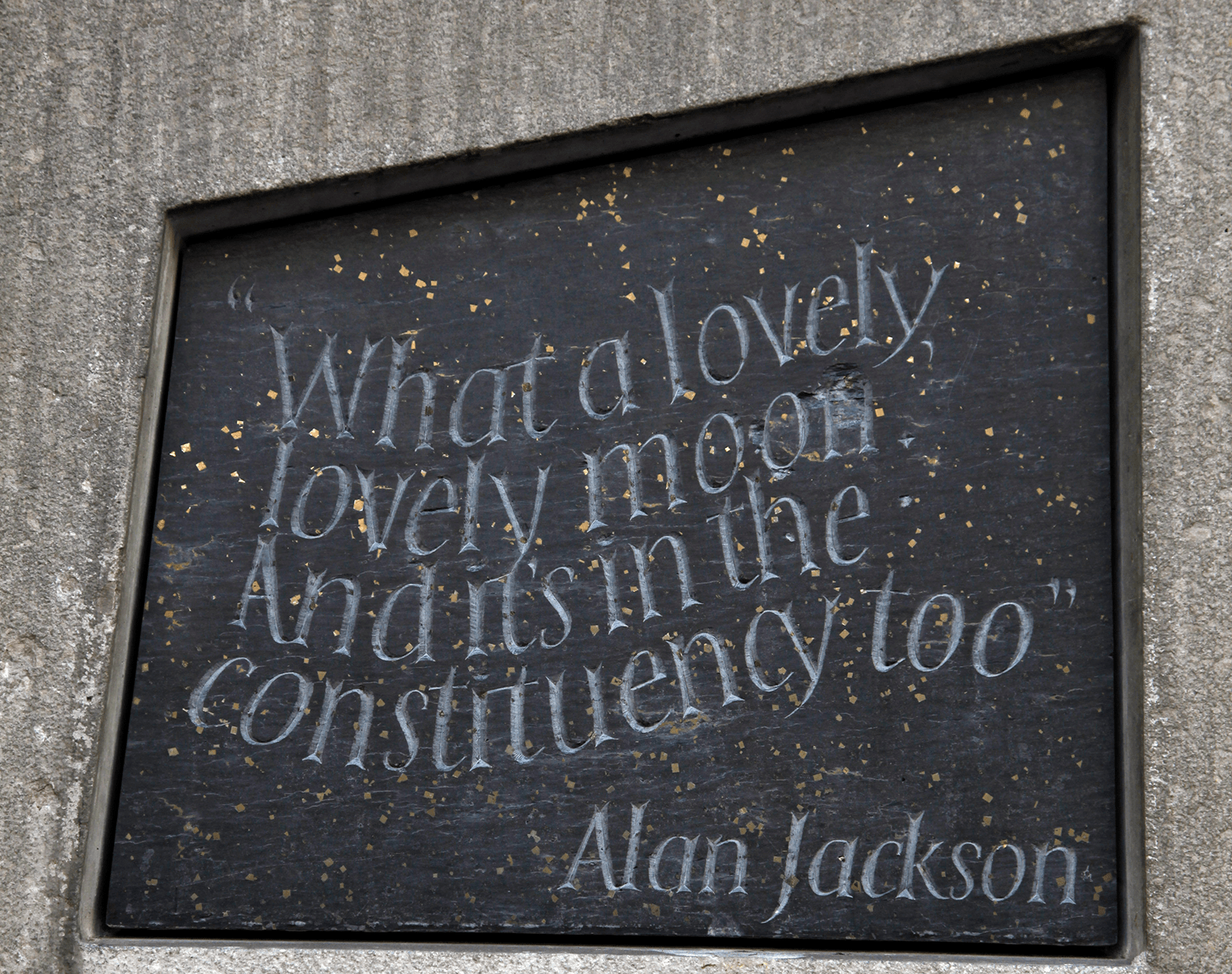 Stone with the following words carved on it: "What a lovely, lovely moon. And it's in the constituency too. Alan Jackson"