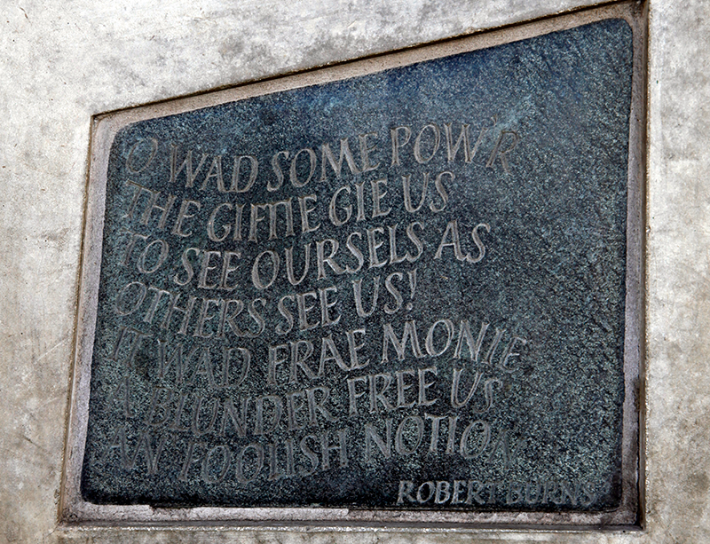 Stone with the following words carved on it: "O wad some Pow'r the giftie gie us To see oursels as others see us! It wad frae monie a blunder free us An' foolish notion. Robert Burns"