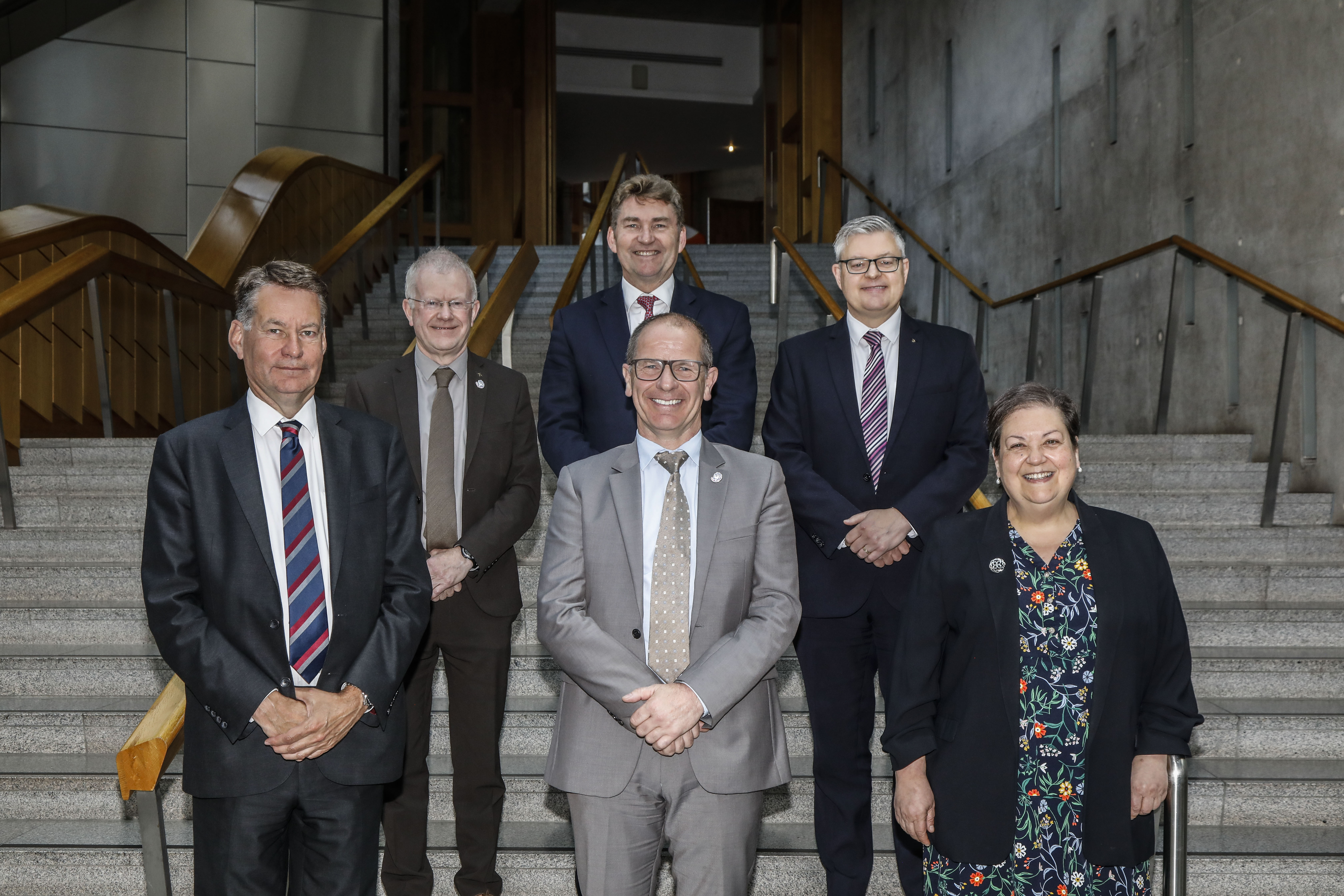 Photo of committee members: (front from left) Murdo Fraser MSP, Jim Fairlie MSP, Jackie Baillie MSP; (back from left) John Mason MSP, Brian Whittle MSP, Stuart McMillan MSP.